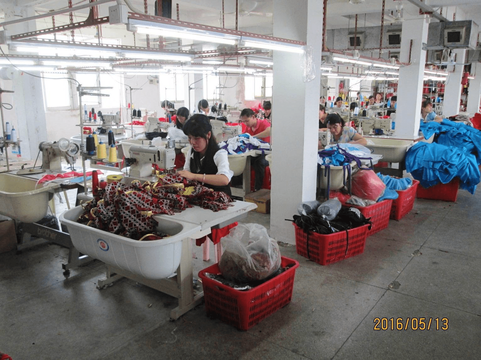 Supplied sewing line with garments in production